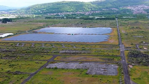 Aerial with Sunlight on Modern Solar Panel Array on Flat Landscape Stock Footage 335282513