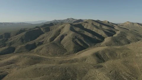 Aerial sunlight view of Mountain Range Mojave desert a remote Extreme Terrain Stock Footage 76853257