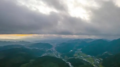 Aerial sunrise clouds drifting over the Yunnan-Guizhou Plateau mountain Stock Footage 342118783