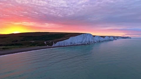 Aerial Sunrise Over White Cliffs, Beach and Gentle Ocean Waves Stock-Footage 341212327