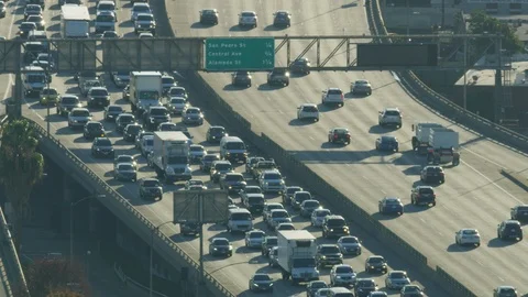 Aerial sunrise view congested traffic travelling to LA Stock Footage 104244429
