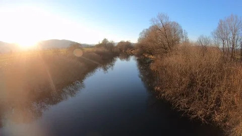 AERIAL Sunset above the tranquil river Stock Footage 101074559