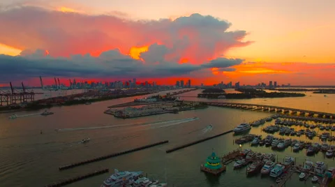 AERIAL - Sunset - AMAZING RED SKY - Dusk in South Beach looking into Miami sk Stock Footage 66479679