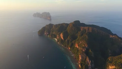 Aerial sunset cliffs of Koh Phi Phi island with long coastline Thailand Stock Footage 334088146