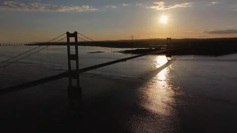 Aerial Sunset Drawk Right to Left of the Severn Bridge from the M48 스톡 동영상 274480936