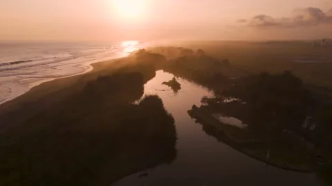 Aerial Sunset Dusk View at Beach Coastline, Laguna Glagah Lake, Indonesia Видео 253760355
