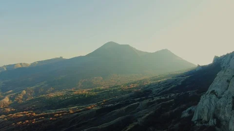 AERIAL sunset fall in the mountains moving along the slopes view from above Stock Footage 125602934