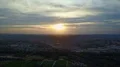 Aerial sunset flight city Braunschweig overview buildings and driving train 4k or 4k+ Resolution