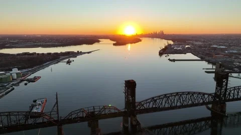 Aerial Sunset Flight Down Delaware River Towards Center City Philadelphia Stock Footage 168214424