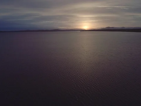 Aerial sunset flight low over the reeds in the lake at Mungo Brush National Stock Footage 77818451