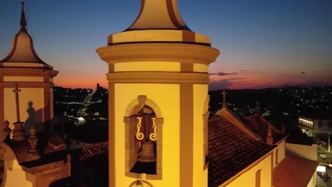 Aerial sunset flight of Our Lady of Oliveira Church Stock Footage 320357363