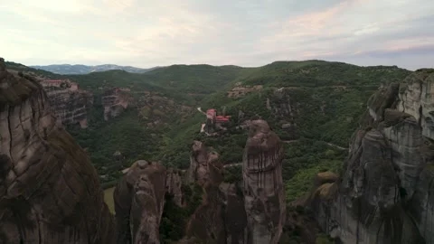 Aerial Sunset Flight Over Rocks To Holy Monastery of Great Meteoron at Suns.. Stock Footage 334893700