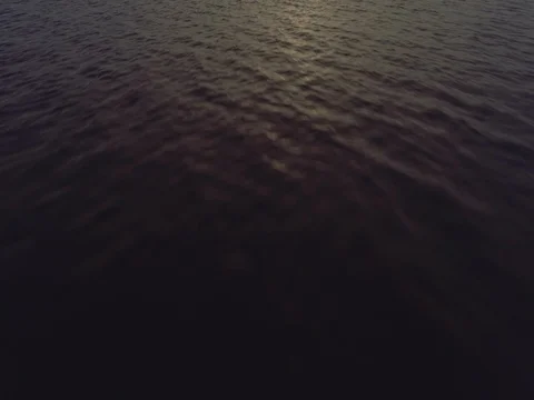 Aerial sunset flight tilting up over the lake at Mungo Brush National Park. Stock Footage 77980940