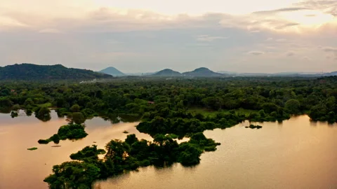 Aerial sunset lake studded with green islets Stock Footage 337915519