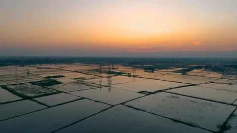 Aerial sunset landscape floods fields of countryside Thailand. Video stock 129099012