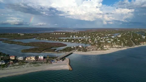 Aerial Sunset Over Blind Pass Bridge with Rainbow on Sanibel Island Florida Stock Footage 330951833