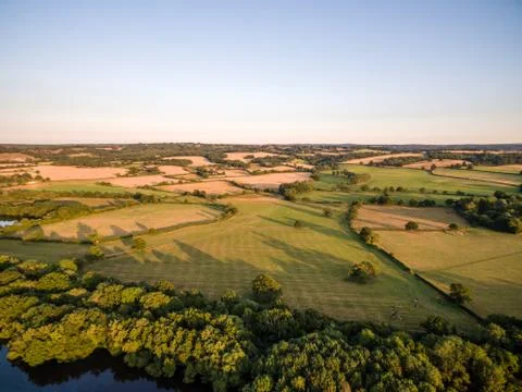 Aerial Sunset over fields Stock Photos