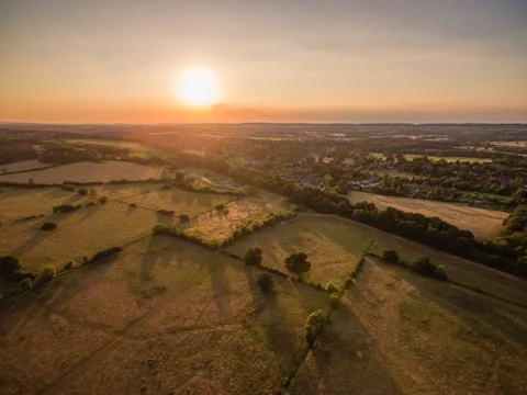 Aerial Sunset over fields Stock Photos