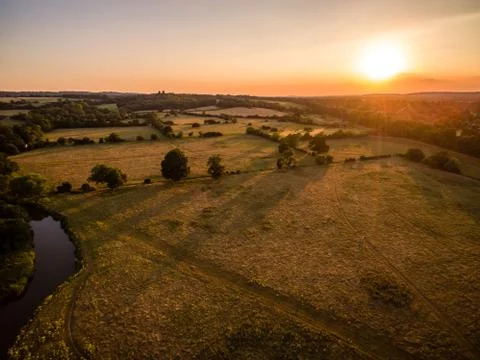 Aerial sunset over fields Stock Photos