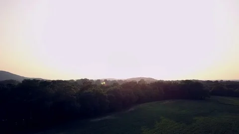 Aerial Sunset Over Grassy Fields 4K Video stock 77774974