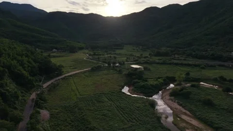 Aerial sunset over green mountain valley in Vietnam Stockbeeldmateriaal 339753553