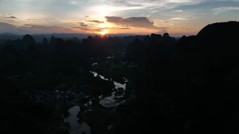 Aerial Sunset Over Karst Mountain Valley With River In Yangshuo Guilin Vídeos de archivo 313061426