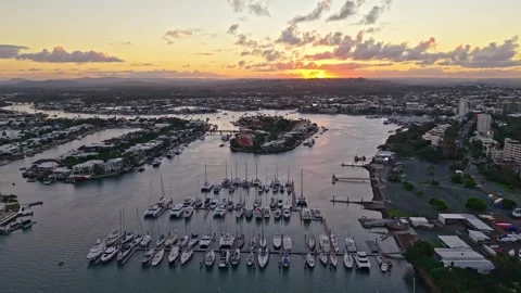 Aerial sunset over Mooloolaba Harbour marina and river channels, Sunshine C.. Stock Footage 333444842