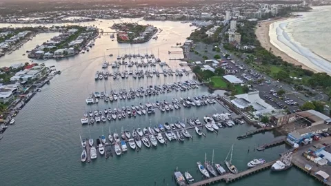 Aerial sunset over Mooloolaba Harbour marina and river channels, Sunshine C.. Stock Footage 333445129