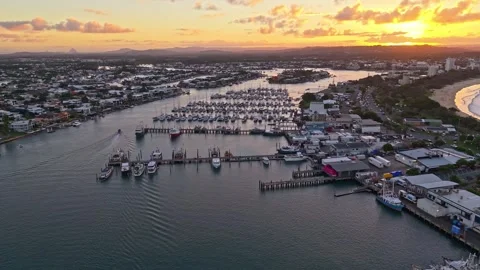 Aerial sunset over Mooloolaba Harbour marina and river channels, Sunshine C.. Stock Footage 333445323