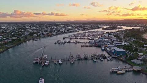 Aerial sunset over Mooloolaba Harbour marina and river channels, Sunshine C.. Stock Footage 333445372
