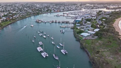 Aerial sunset over Mooloolaba Harbour marina and river channels, Sunshine C.. Stock Footage 333445380