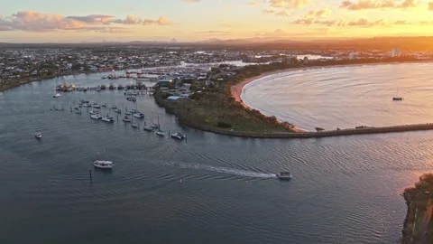 Aerial sunset over Mooloolaba Harbour marina and river channels, Sunshine C.. Stock Footage 333445504