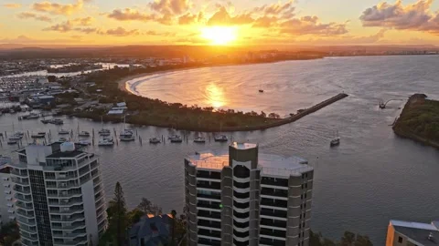 Aerial sunset over Mooloolaba Harbour marina and river channels, Sunshine C.. Stock Footage 333445531