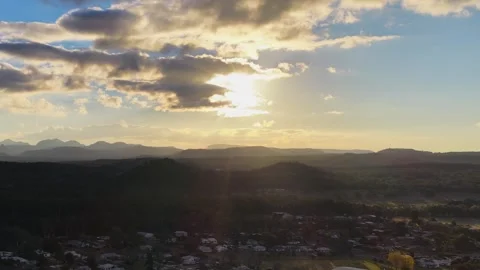 Aerial Sunset Over Outback Town and Mountain Horizon Stock Footage 340381239