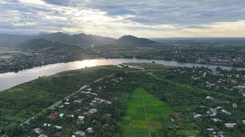 Aerial sunset over Perfume River and mountains near Hue 4K Stock Footage 339863631