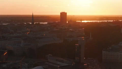 Aerial sunset over Riga Old Town spires, clock tower, Daugava 스톡 동영상 338036451