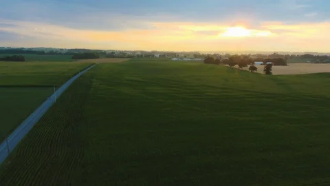 Aerial Sunset Over Sprawling Fields and Farms Stock Footage 112771693