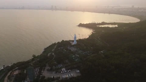 Aerial sunset Panoramic over the distant Da Nang city skyline Stock Footage 323342220