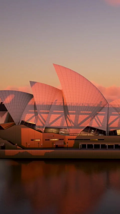 Aerial sunset side view of the Sydney Opera House over the Harbor Bridge Stock Footage 284464979