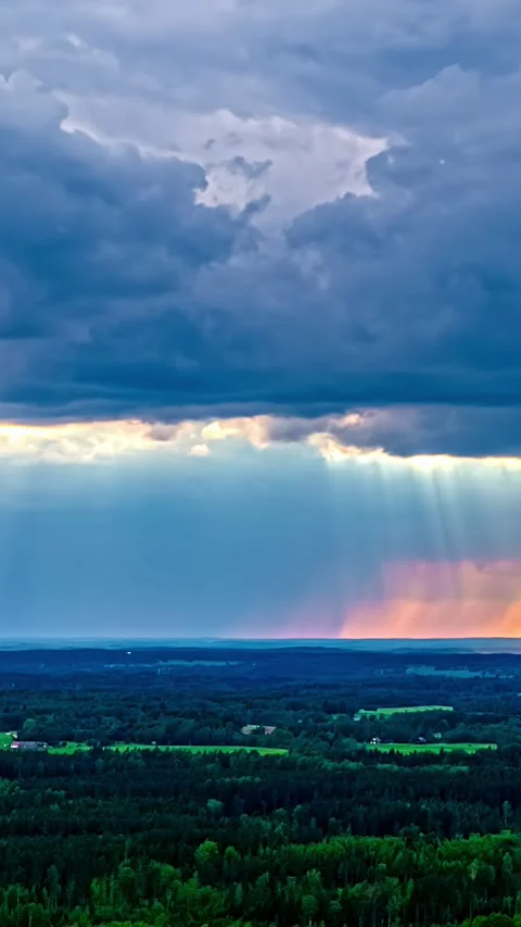 Aerial Sunset Timelapse Of Sunbeams Through Storm Clouds Over Latvian Forest Stock Footage 344922186