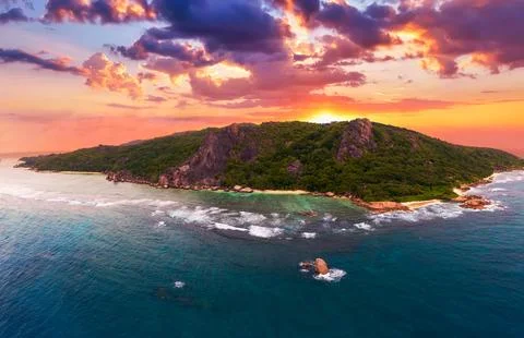 Aerial sunset view of Anse Source D'argent beach at La Digue Island, Seychelles Foto stock