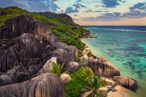 Aerial sunset view of Anse Source D'argent beach at La Digue Island, Seychelles Foto stock