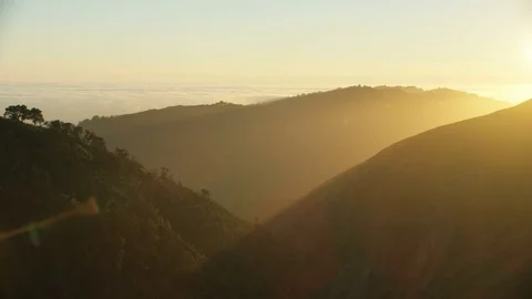 Aerial sunset view Big Sur mountains sun flare Stock Footage 80023022