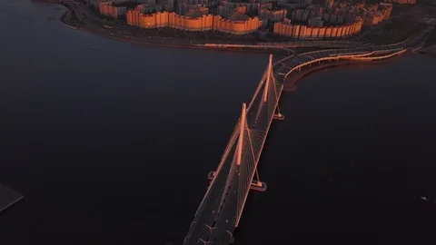 Aerial sunset view cable Bridge ZSD road car rooftops zenit arena Stock Footage 108269912