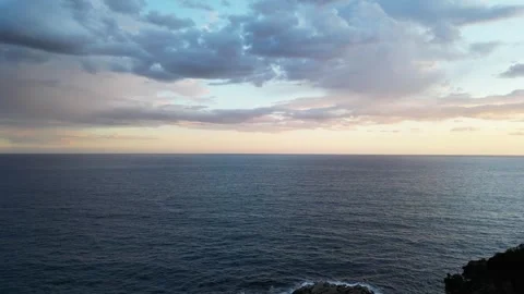 Aerial sunset view, flying over the forest to the cloudscape and sea horizon, 4K Stock Footage 274852209