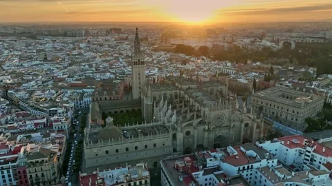 Aerial sunset view of gothic cathedral in Seville old town with famous Giralda Stock Footage 173461467