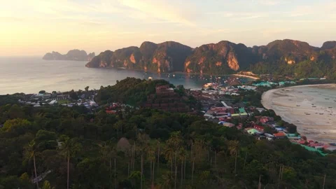 Aerial sunset view of Koh Phi Phi Island, Thailand, with dramatic limestone Stock Footage 334087860
