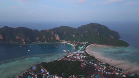 Aerial sunset view of Koh Phi Phi Don, Thailand, showing twin bays, turquoise Stock Footage 334350184