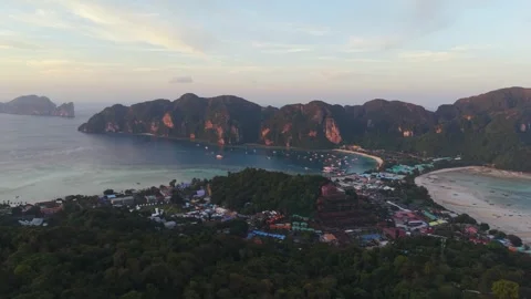 Aerial: sunset view of Koh Phi Phi Islands with golden hour colors in the Stock Footage 334350401