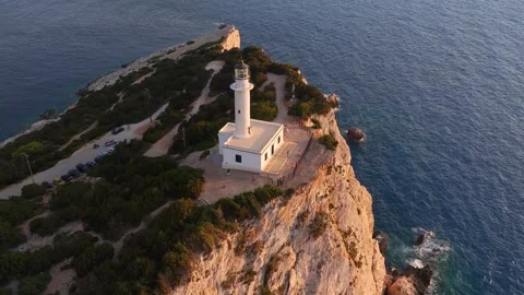 Aerial sunset view of the lighthouse at Cape Lefkatas on Lefkada island Video stock 310834773